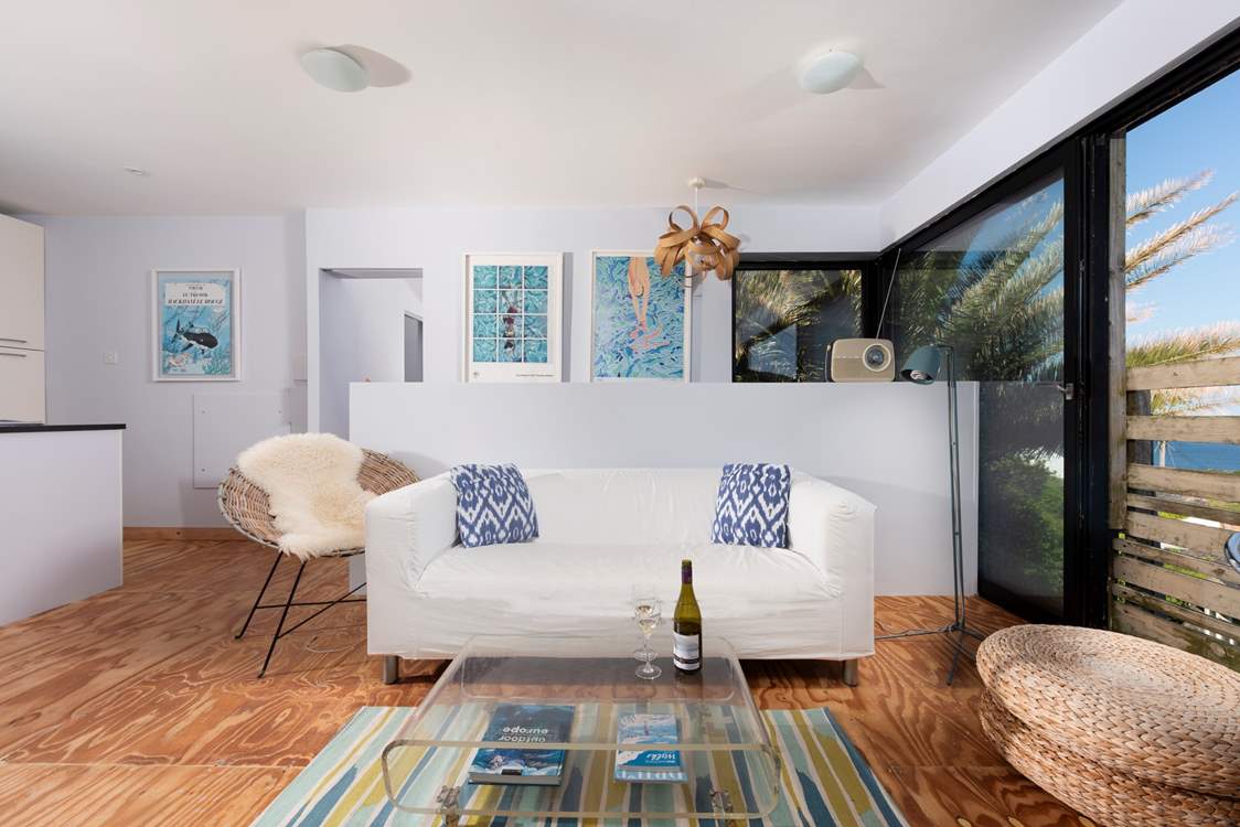 Interior touches of turquoise and lime blend seamlessly with the palm tree fronds and ocean views.