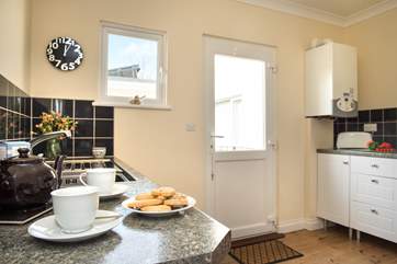 The kitchen is well-equipped and provides easy access to the garden.