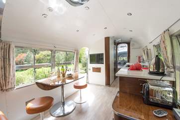 The table can be used as shown here or turned around to face the seating.