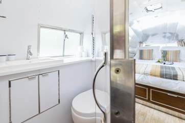 The shower-room is between the kitchen and bedroom.