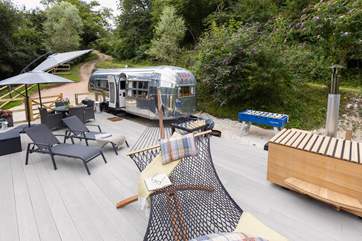 Make the most of this private decking area, kitted out with a hammock, Japanese wood-fired spa bath and barbecue.