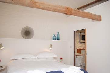 Three steps go up to the pretty bedroom in The Hay Barn (2597).