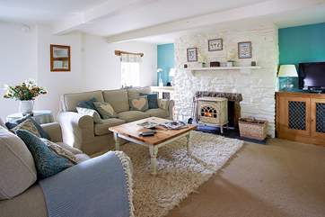The cosy seating-area around the wood-burner in Medlar Cottage (2595).