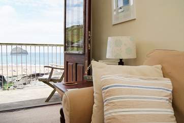 The French doors lead out to the patio where you will have a seagull's view of the beach.
