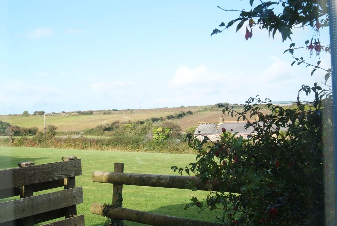 From the patio doors of the kitchen/dining-room there are countryside views.