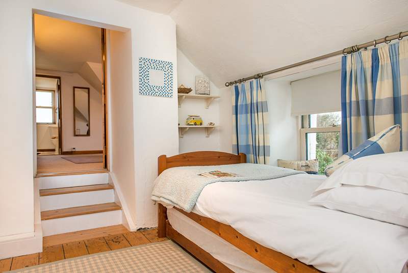 The single bedroom leads to the double bedroom (up three stairs) and the en suite.
