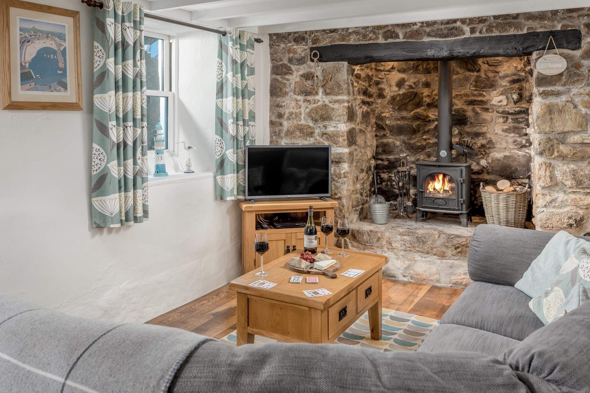 Snuggle down with a tasty glass of wine in front of the roaring wood-burner.