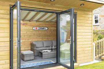 The garden room is perfect for relaxing on holiday.