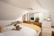 The principal bedroom has plenty of space and it tucked away for a good night's slumber.