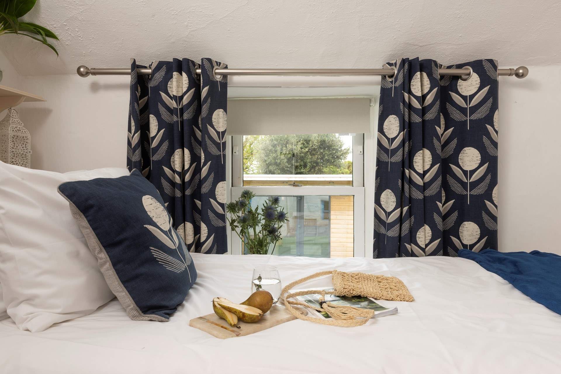 The single bedroom looks out across the garden at the front of the cottage.