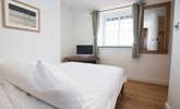 The first floor double bedroom has a television and great sea views. - Thumbnail Image