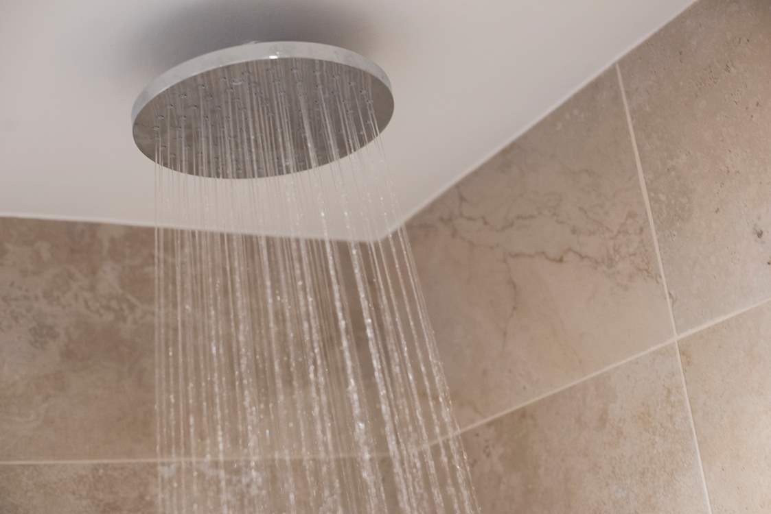 The bathroom has a fitted shower.
