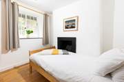 A single sweet bedroom on the first floor.