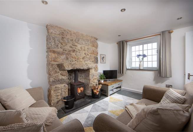 Cosy up in the sitting-room and light the wood-burner on chillier days. 