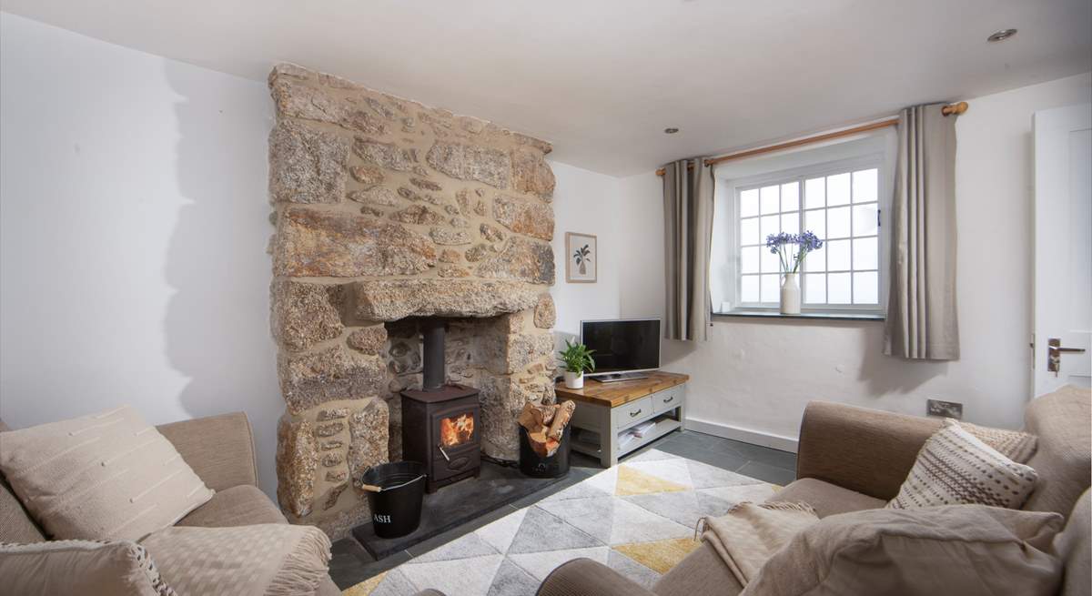 Cosy up in the sitting-room and light the wood-burner on chillier days. 