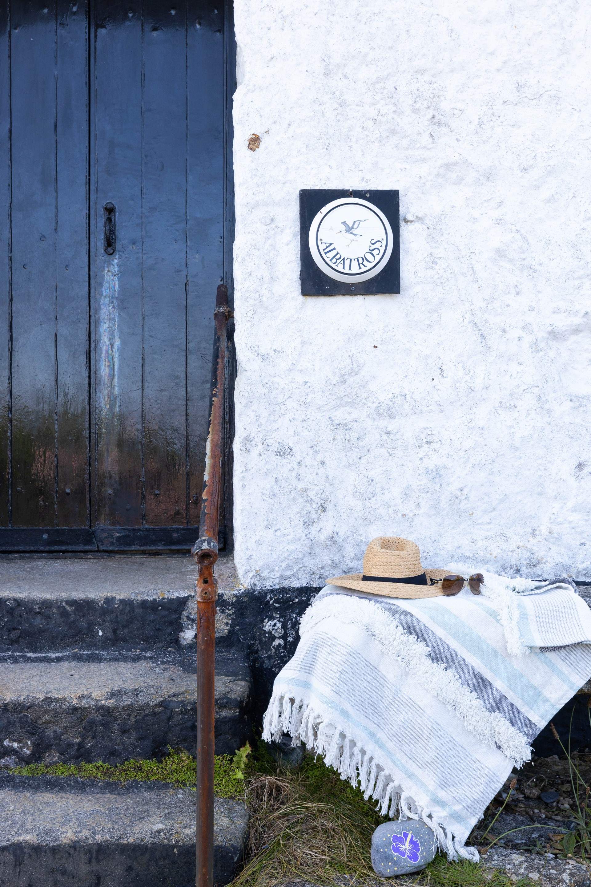 Granite steps lead to this traditional cottage.
