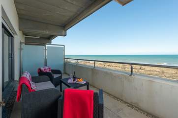 This is the view of the balcony in the other direction. There is plenty of outside seating for relaxing and eating al fresco.