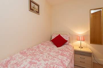 The single bedroom is to the left as you enter the apartment.