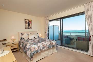 This is the main bedroom with balcony access.