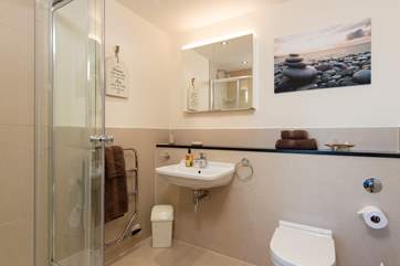 The main bedroom has a spacious en suite shower-room.