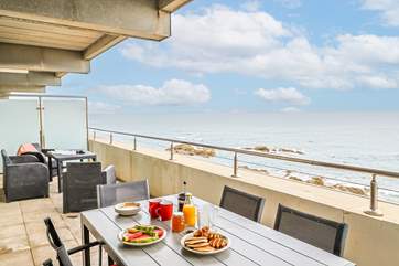 This is the view of the balcony in the other direction. There is plenty of outside seating for relaxing and eating al fresco.