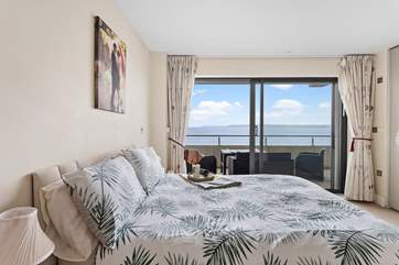 This is the main bedroom with balcony access.