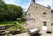 The easterly side of the mill has a great patio-area that straddles the leat.