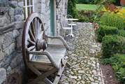 There are cobbled pathways and garden seats dotted around.