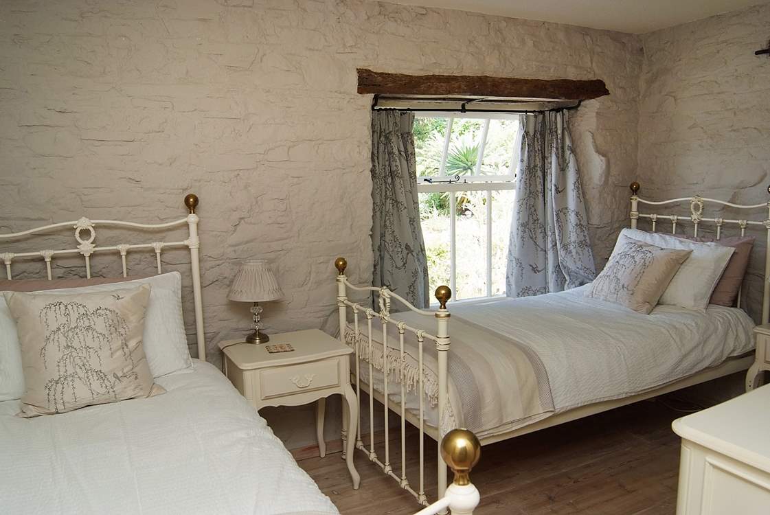 The twin bedroom in the mill is next to the double bedroom.