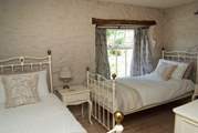 The twin bedroom in the mill is next to the double bedroom.