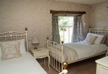 The twin bedroom in the mill is next to the double bedroom.