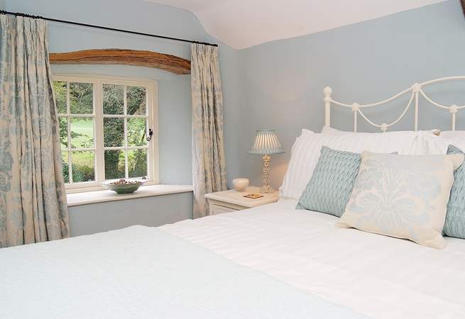 The double bedroom (Bedroom 1) in the cottage is beautifully styled.