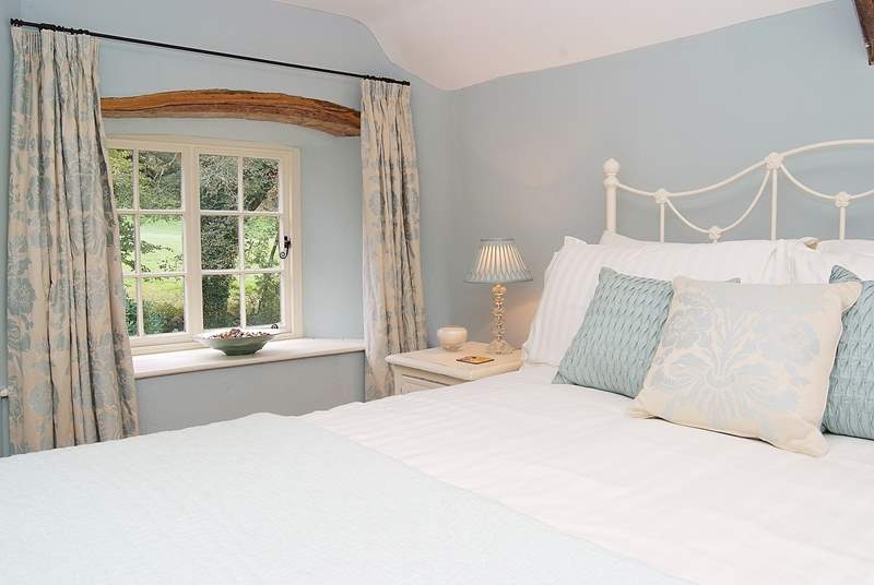 The double bedroom (Bedroom 1) in the cottage is beautifully styled.