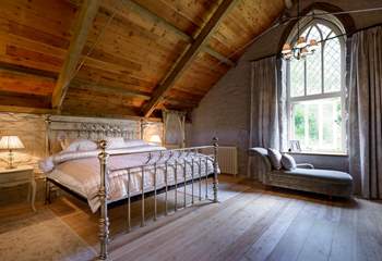 The stunning master bedroom (Bedroom 5) on the top floor of the mill.

