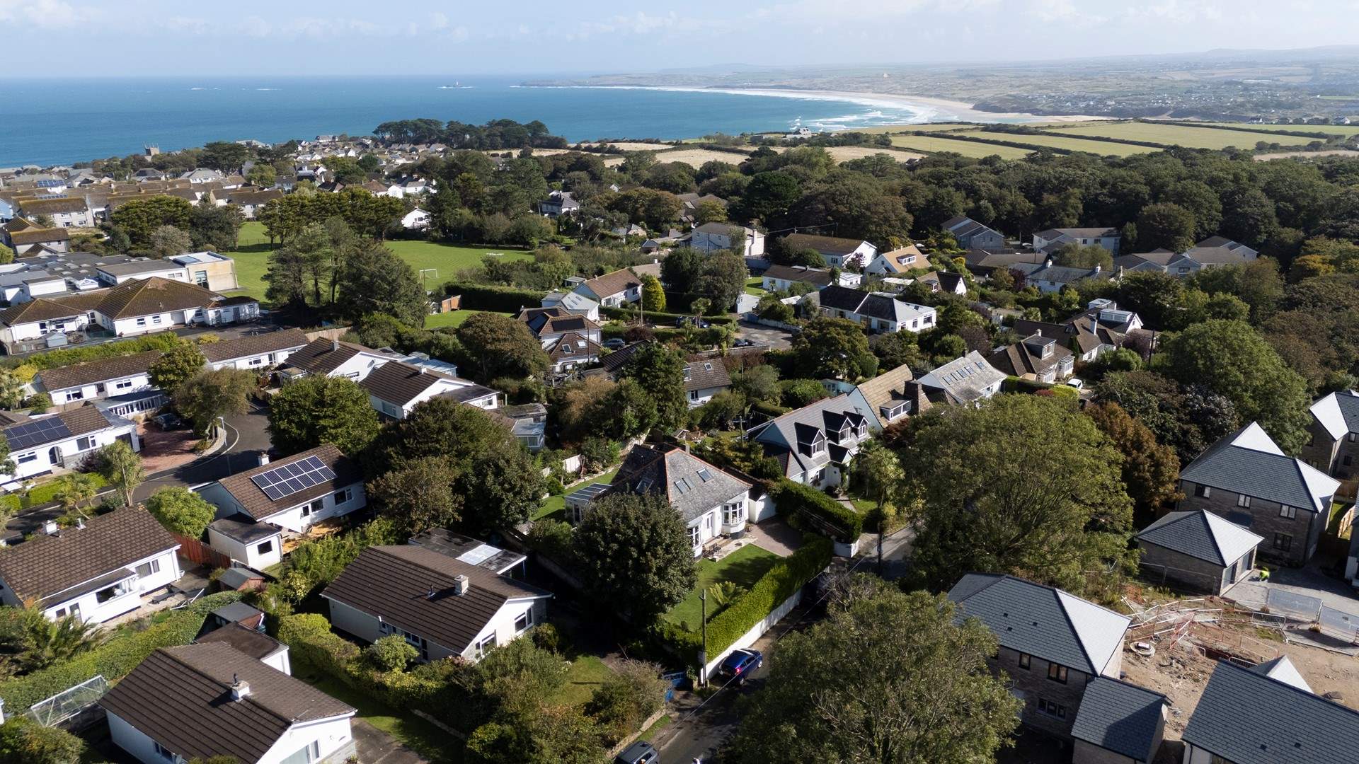 An aerial shot of the outstanding coastline in Carbis Bay, Trevail is the second bungalow on the left at the bottom of this picture.