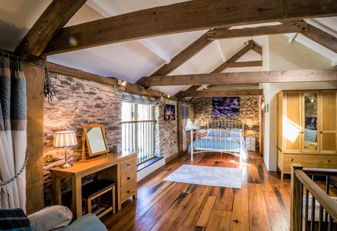 Bedroom 2 is a real treat with its beautiful beams and stunning wooden floors.