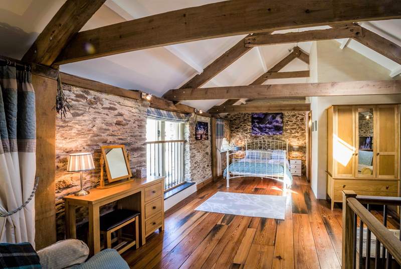 Bedroom 2 is a real treat with its beautiful beams and stunning wooden floors.