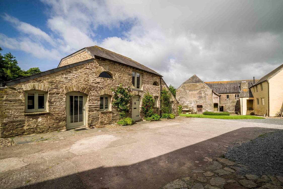 Looking across at the front of Leigh Barn, with the owner's house situated to the right of the picture.