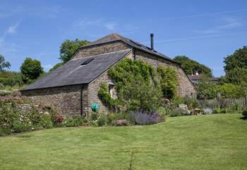 Behind Leigh Barn lies the most lovingly maintained gardens and lawn.