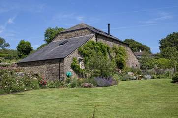 Behind Leigh Barn lies the most lovingly maintained gardens and lawn.