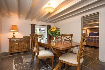 The sitting-room leads off from the dining-room.