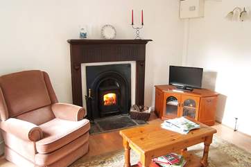 There is a second wood-burner in the sitting-room so you can sit comfortably beside the fire.