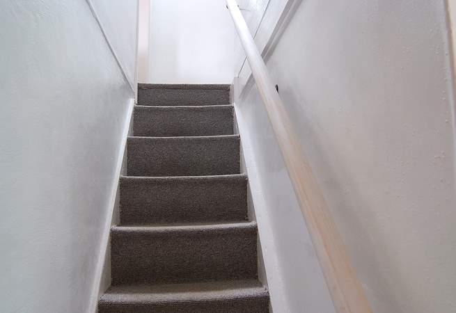 The cottage stairs are typically steep but there is a handrail.