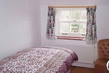 Bedroom 2 is a pretty single bedroom that also looks out towards the church.