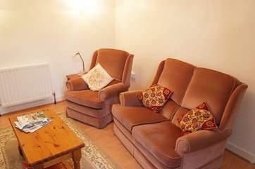 Comfy seating in the sitting-room.