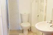 The downstairs shower-room has a large shower cubicle and heated towel rail.