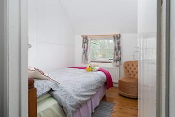 Bedroom 2 is a pretty single bedroom, looking out towards the church.