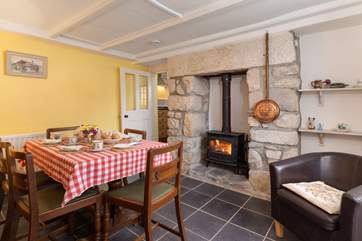 Relax in the dining-room next to the cosy wood-burner.