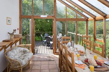 French doors lead from the dining-room to the outside terrace.