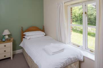 This is Bluebell, a spacious single bedroom that looks out over the front of the cottage. It has an en suite shower-room.